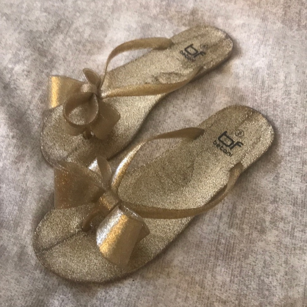 Gold plastic bow sandals